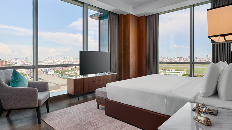 Image is a rendering of a guestroom at the upcoming Crowne Plaza Phnom Penh 