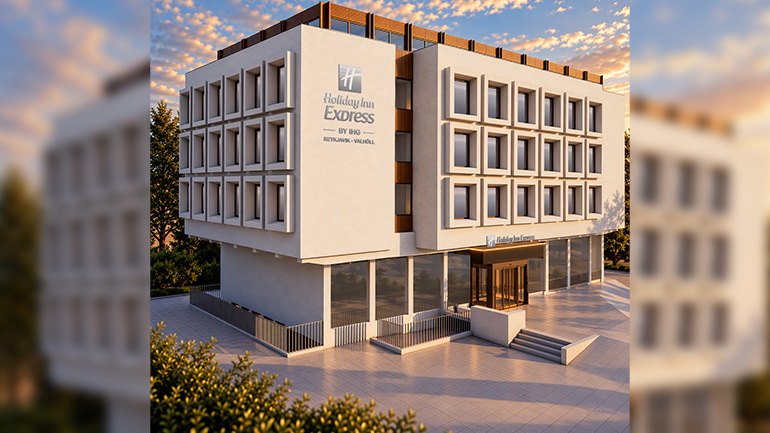 Architectural rendering of the Holiday Inn Express Reykjavík–Valhöll, showing a modern four-storey hotel with a white geometric façade, large ground-floor windows and the hotel signage, pictured in warm evening light.