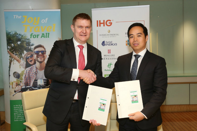 IHG's Kenneth Macpherson with Doan Quoc Huy, Vice President BIM Group, at the Holiday Inn & Suites® Vientiane signing ceremony.